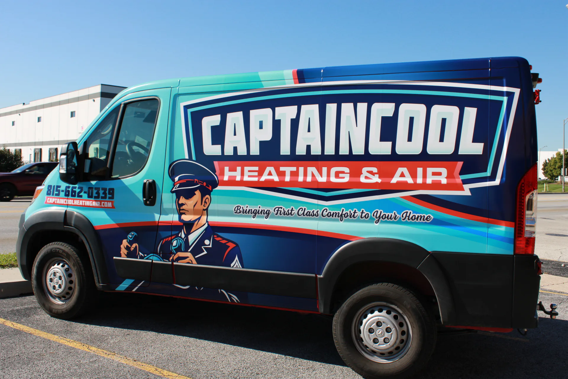 Captain Cool Heating & Air wrapped service van, full side view with the captain mascot and phone number