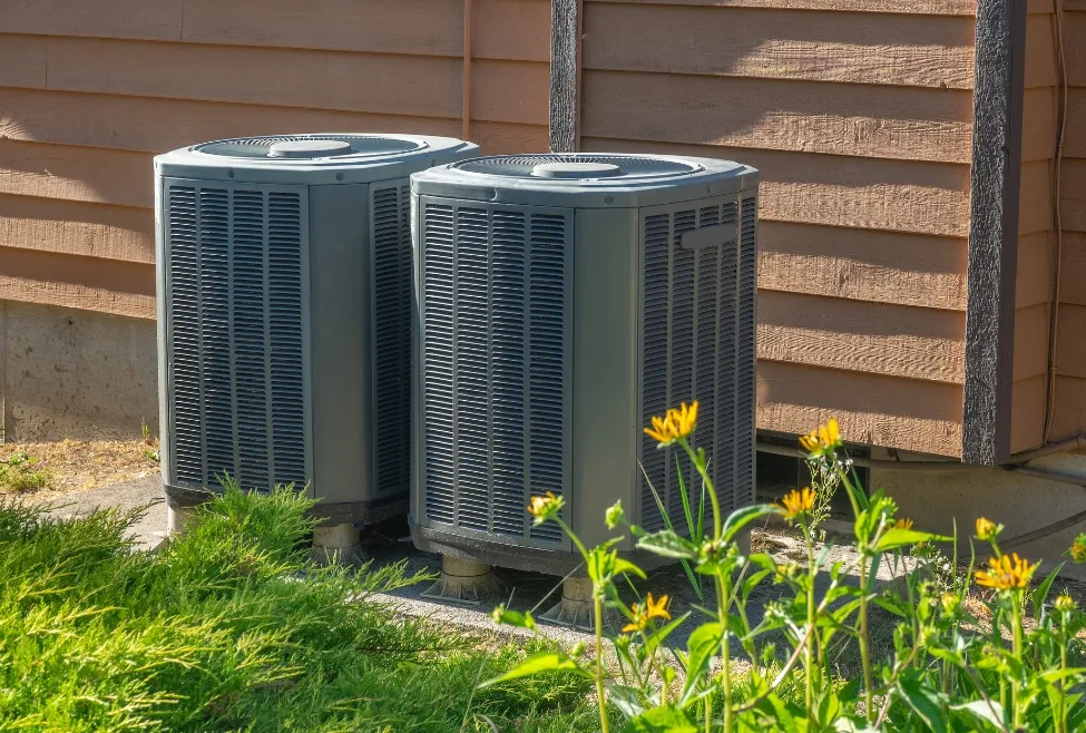 Air conditioner not blowing cold air, outdoor AC unit with possible refrigerant leak, frozen coils, or airflow issues, h